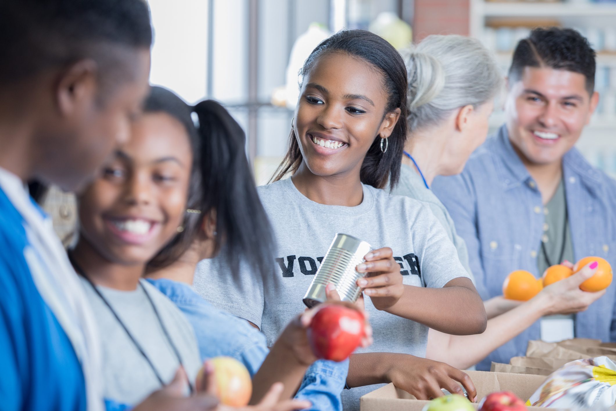African American family volunteer during food drive